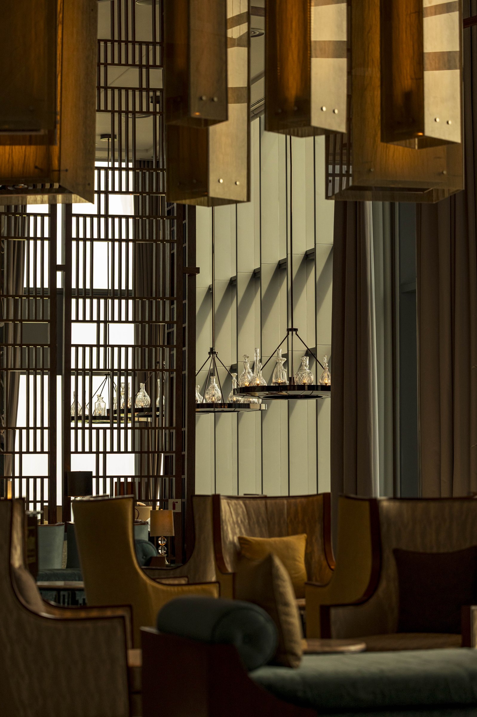 Lounge with sculptural pendant lighting